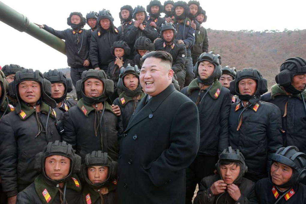 An undated photograph shows North Korean leader Kim Jong-un reviewing his army’s tank crews. Photo: EPA