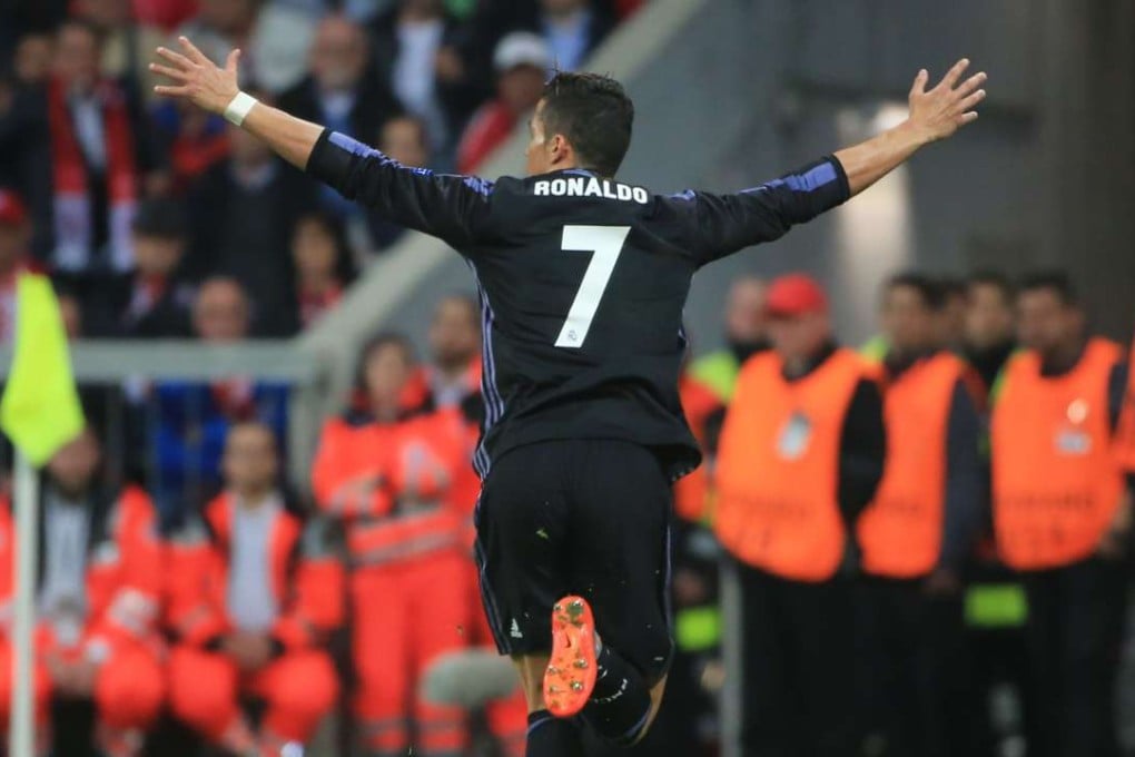 Real Madrid’s Cristiano Ronaldo wheels away after notching his 100th European goal in the 2-1 win over Bayern Munich. Photo: Xinhua