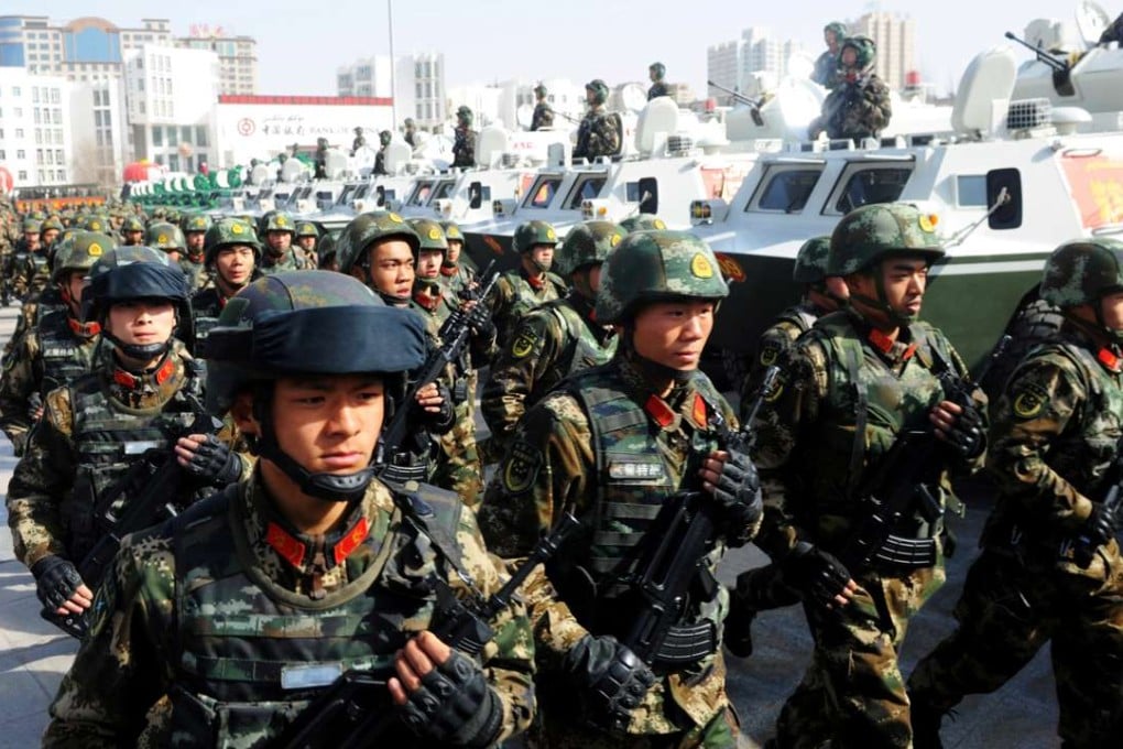 A file picture of paramilitary policemen taking part in a rally in Kashgar in Xinjiang in February. Photo: Reuters