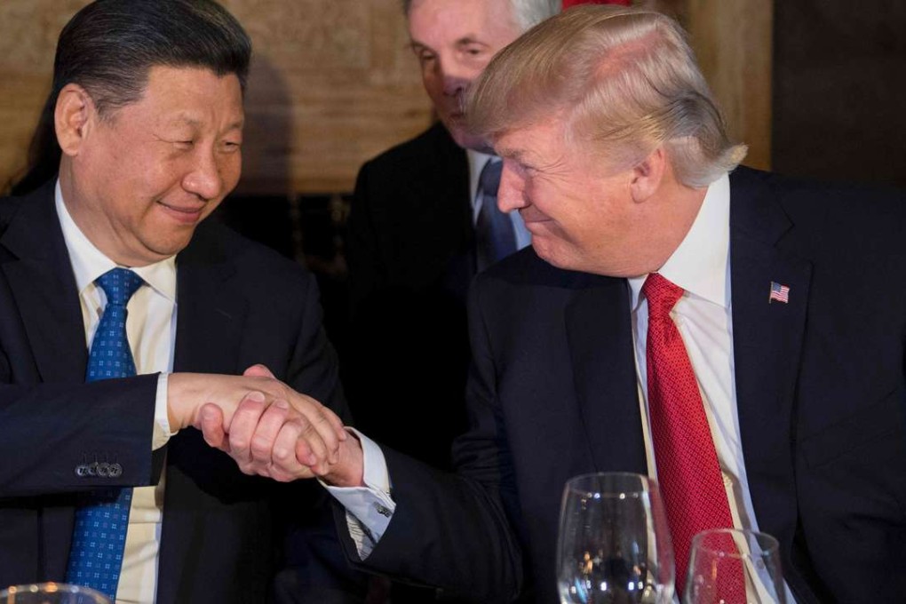US President Donald Trump (R) and Chinese President Xi Jinping (L) shake hands during dinner at the Mar-a-Lago estate in West Palm Beach, Florida. The resort was cited for a string of food safety violations by the state. Photo: AFP