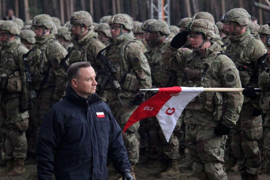Polish President Andrzej Duda (C) attends a welcome ceremony for the North Atlantic Treaty Organization (NATO) Enhanced Forward Presence (eFP) contingent in the Military Training Centre of the Land Forces in Orzysz, Poland. The contingent will be stationed in Orzysz to reinforce NATO's eastern flank. Photo: EPA