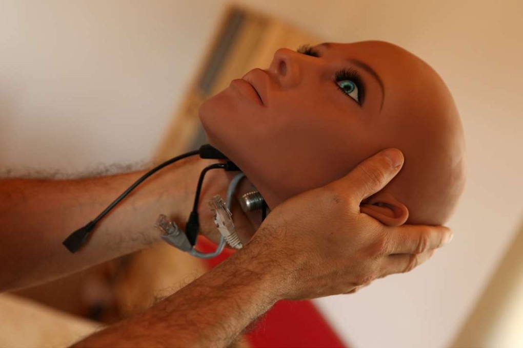 An engineer holds the head of Samantha, a sex doll packed with artificial intelligence providing her the capability to respond to different scenarios and verbal stimulus, in his house in Rubi, north of Barcelona, Spain. Photo: Reuters
