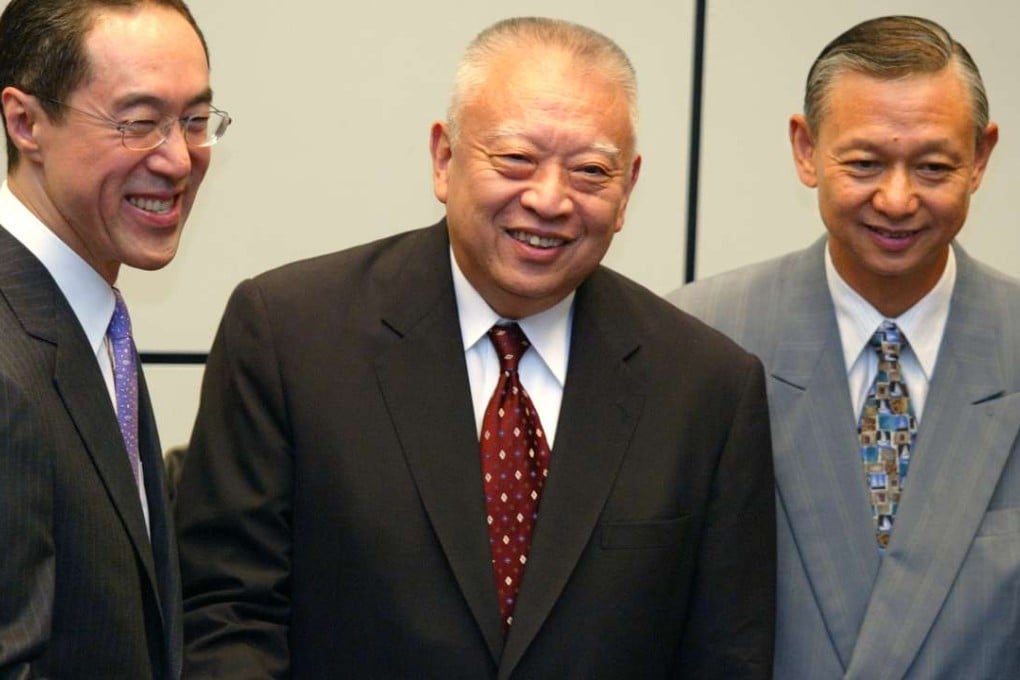 Then chief executive Tung Chee-hwa with his new financial secretary Henry Tang (left) after announcing the appointments of new principal officials at the government headquarters in 2003. Tung introduced the appointment system in 2002. Fifteen years after the city’s experiment with political appointments, a few facts have emerged. Photo: Robert Ng