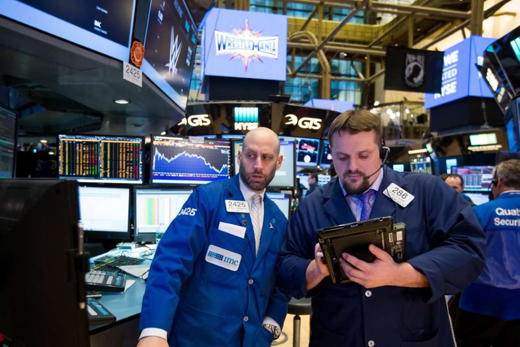 Traders work on the floor of the New York Stock Exchange. The short-term benefits of so-called “passive investing” can have dangerous implications in the long term. Photo: Bloomberg