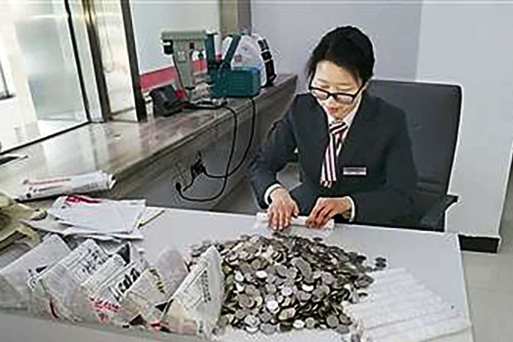 With overtime and working whenever they were free, the bank’s seven staff believed the money could be counted in less than a month. Photo: Handout