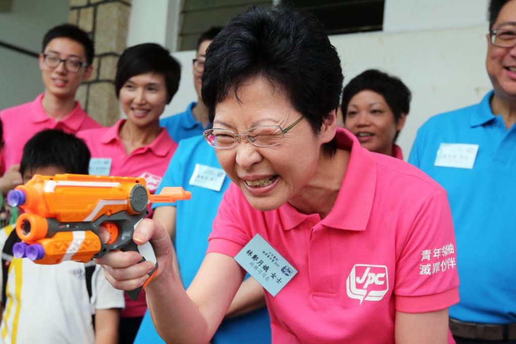 Then chief secretary Carrie Lam visits the Junior Police Call crime-fighting summer camp at Wu Kwai Sha Youth Village in Ma On Shan, on August 12, 2015. Lam’s manifesto for the chief executive election in March placed special emphasis on youth engagement. Photo: Edward Wong