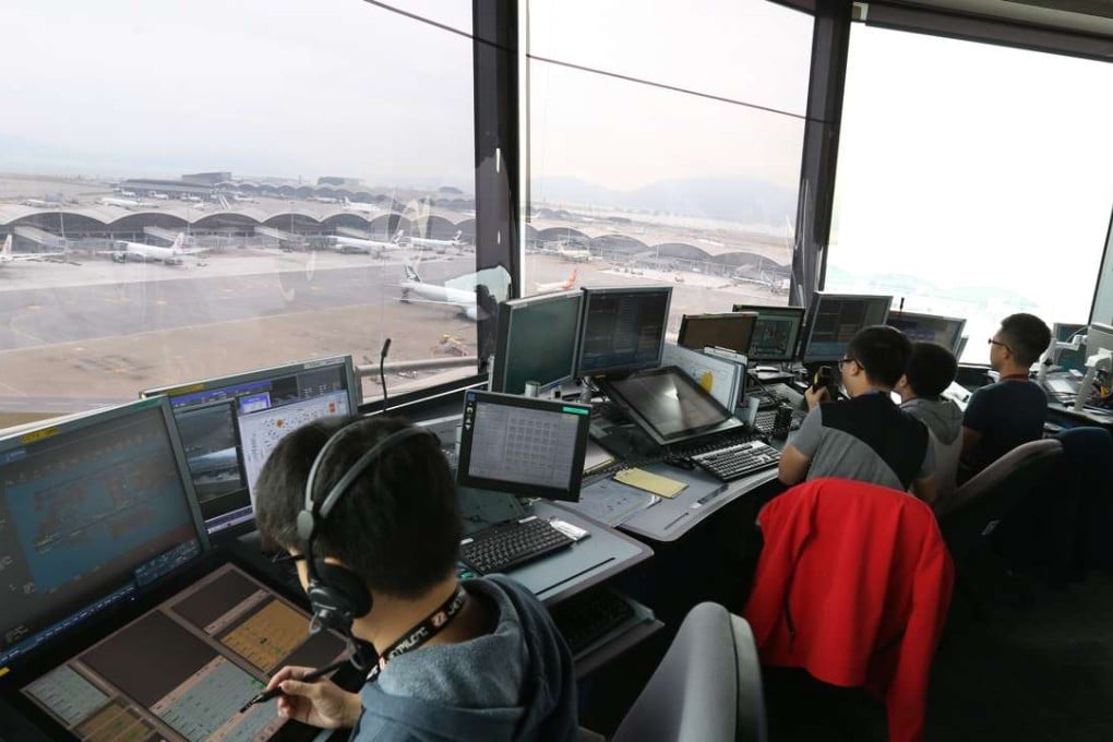 Air traffic controllers using the new system at the north aerodrome tower at Hong Kong International Airport. Photo: Dickson Lee
