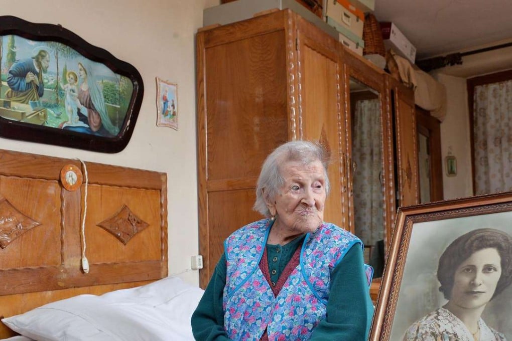 Emma Morano next to a picture of when she was young. Morano, an Italian woman believed to have been the oldest person alive and the last survivor of the 19th century, has died at the age of 117. File photo: EPA
