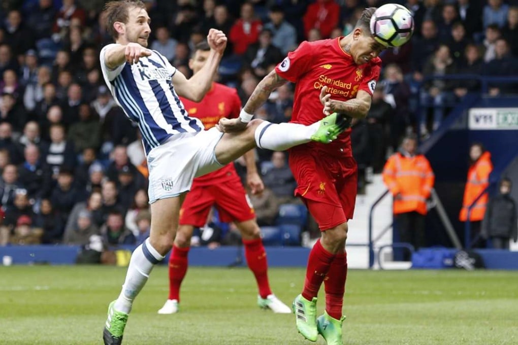 Roberto Firmino heads home for Liverpool in their 1-0 win over West Brom in the English Premier League. Photo: Reuters
