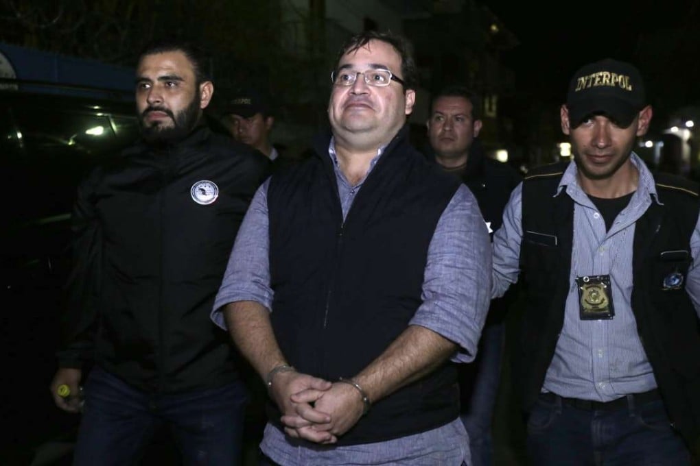 Javier Duarte, former governor of the Mexican state of Veracruz, is escorted by police following his arrest in Guatemala. Photo: AFP