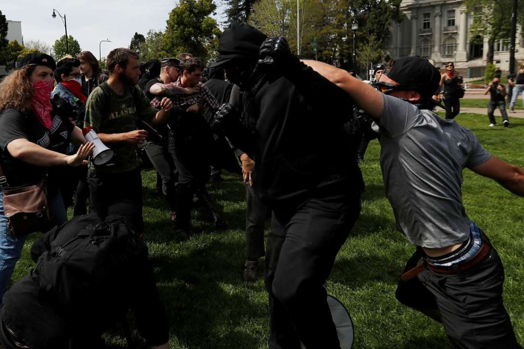 Conservative demonstrators and protesters against Trump in Berkeley. Photo: Reuters