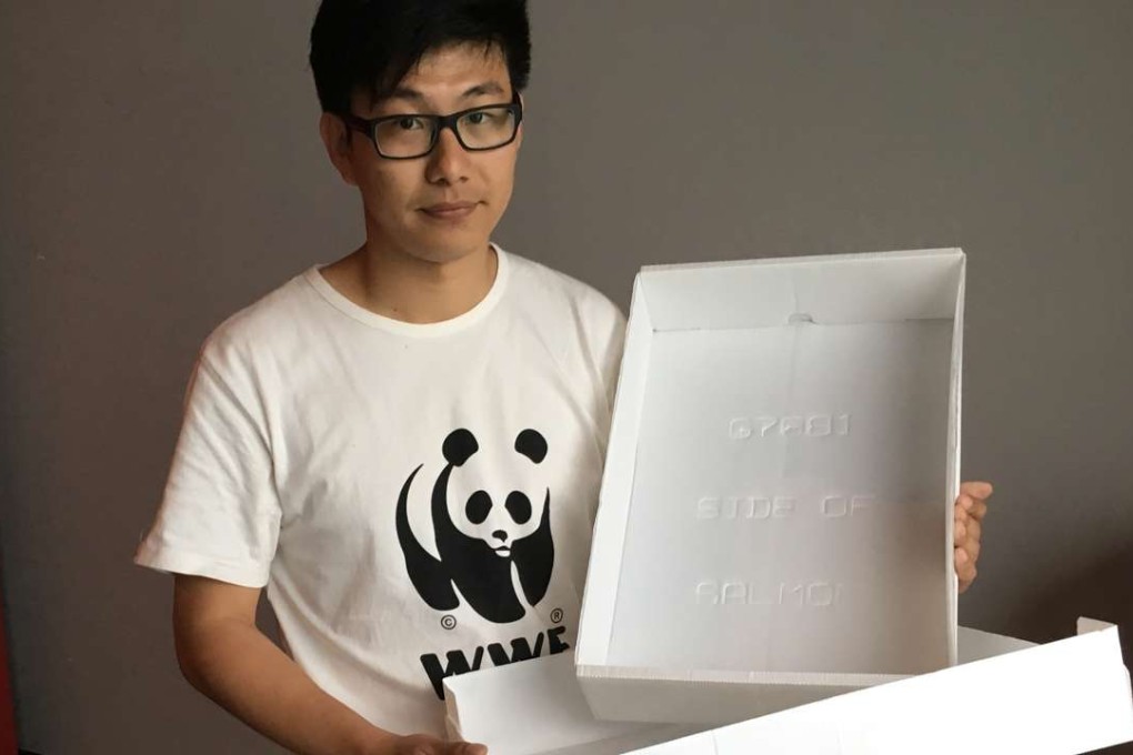 Patrick Yeung of WWF-Hong Kong shows off the kind of plastic box he would like the fishing sector to use. Photo: Ernest Kao