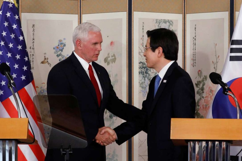 US Vice-President Mike Pence shakes hands with acting South Korean President and Prime Minister Hwang Kyo-ahn during a news conference in Seoul, South Korea. Photo: Reuters