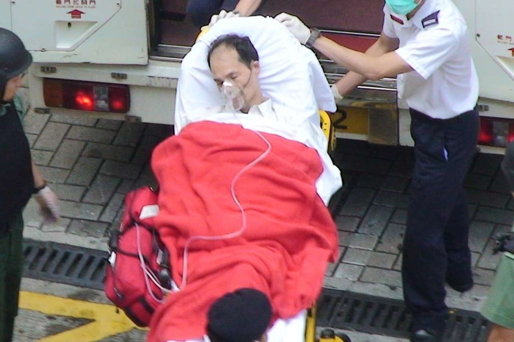 Yip Kai-foon being carried into an ambulance in 2009.