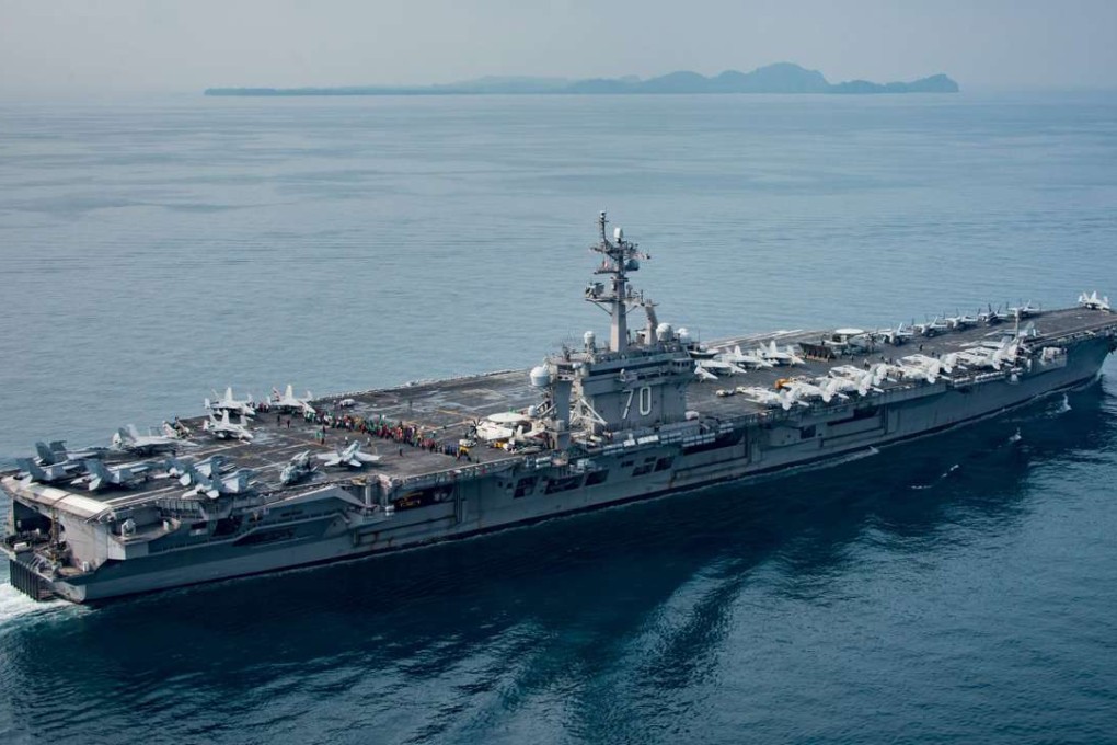 The aircraft carrier USS Carl Vinson transits the Sunda Strait between the Indonesian Islands of Java and Sumatra on April 15, 2017 after the US Navy announced it had sent a carrier-led strike group to the Korean peninsula in a show of force against North Korea's "reckless" nuclear weapons programme. Photo: AFP