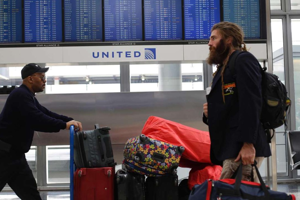 United Airlines has adopted a new policy on booking its own flight crews on to its planes after the airline was ridiculed on social media after the forced removal of a paying passenger from an overbooked flight. Photo: AFP