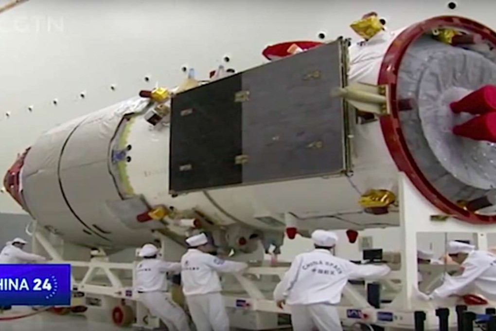Scientists pictured working on the Tianzhou-1 spacecraft. Photo: Handout