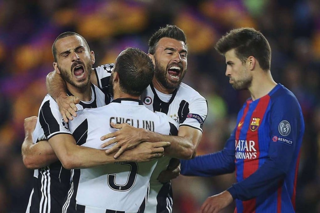 Juventus players celebrate their draw at the Nou Camp. Photo: EPA