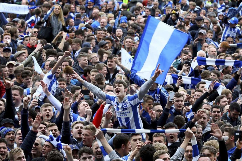Brighton and Hove Albion fans celebrate their team’s return to the Premier League. Photo: AP