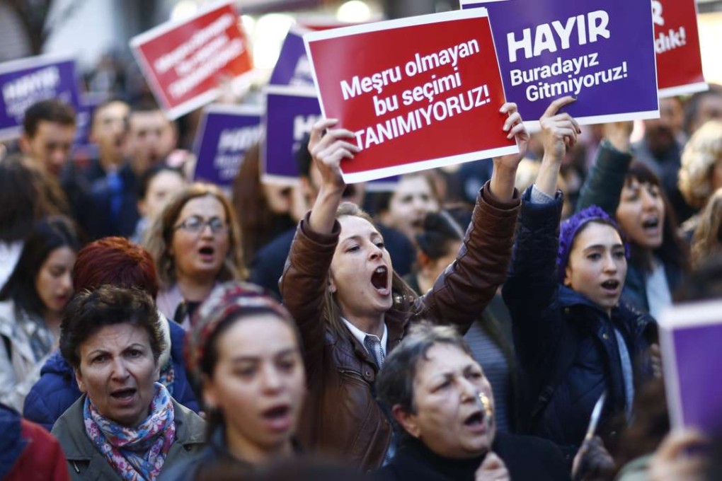 Protesters shout slogans and hold placards reading “NO, it is not finished, just starting”, during rally against the referendum results in Istanbul, Turkey. Turkish President Recep Tayyip Erdogan won a narrow lead of the 'Yes' vote in unofficial results. Photo: EPA