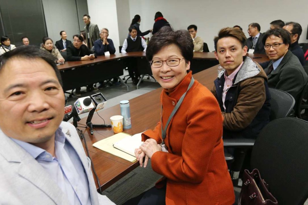 Then chief executive hopeful Carrie Lam with lawmaker Wu Chi-wai (left) and other members of the Democratic Party, in Tamar on February 19. Photo: Dickson Lee