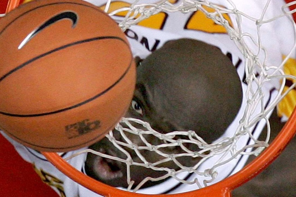 Arizona State's Serge Angounou eyes a rebound during their 71-68 loss to Oregon State at the 2006 PAC-10 Men's Basketball Tournament in Los Angeles on March 8, 2006. Photo: Reuters
