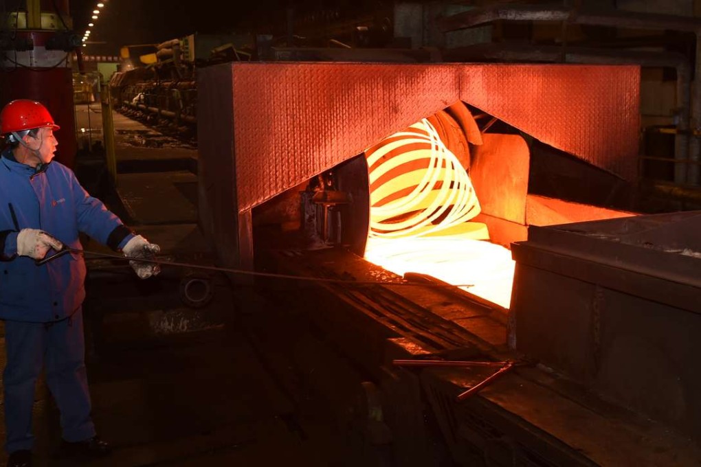 A man works the production line of steel components for pen tips at Taiyuan Iron and Steel in Taiyuan in north China's Shanxi Province. China produces half the world’s steel and churned out a record quantity in March amid a construction boom. Photo: Xinhua