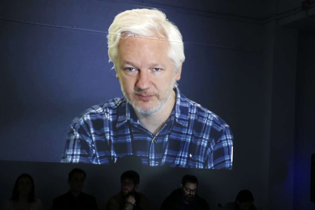 Wikileaks' founder and editor in chief Julian Assange is seen on screen during a videoconference on tax evasion in Madrid, Spain, on March 31. Photo: EPA