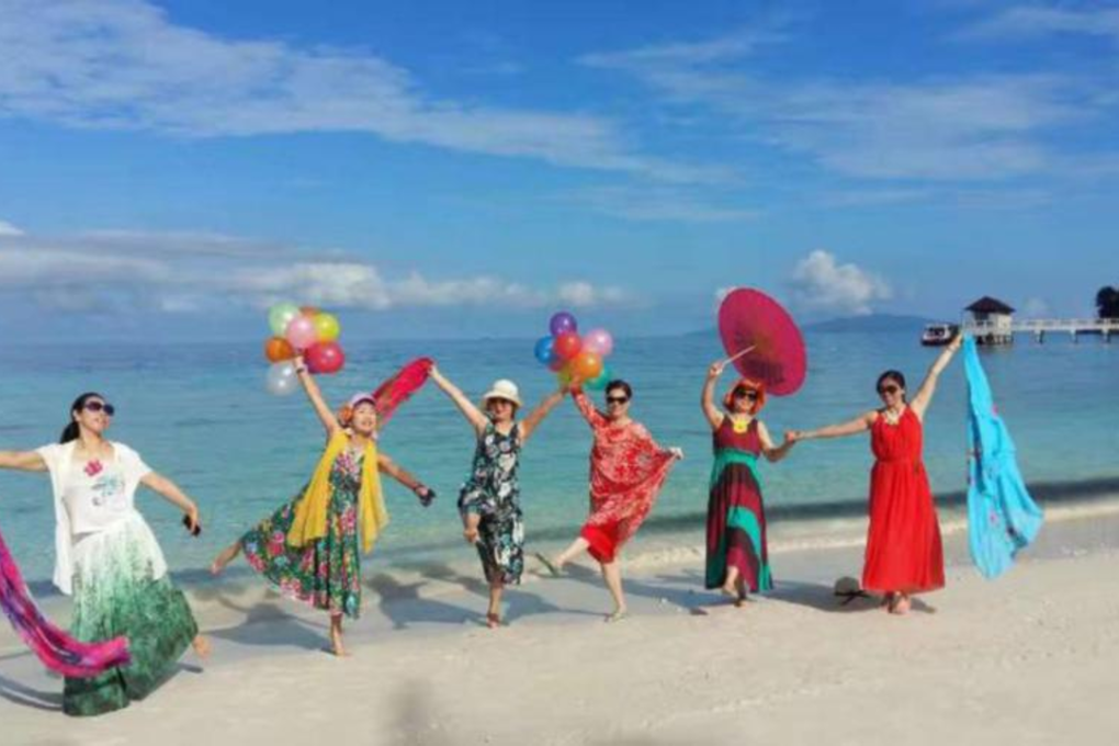 A group of women tourists frolicking on the one-of-a-kind coral dust beach that sparkles at night under the moonlight at the Summer Bay Resort Lang Island, Terengganu. Photo: Adrian David