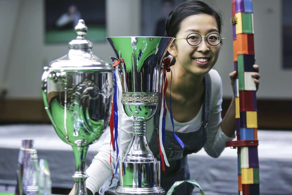 Ng On-yee poses with her three major titles at the World Snooker Club 147 at Midland Centre, Sheung Wan. Photos: Xiaomei Chen