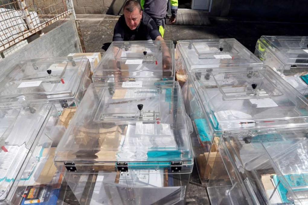 A municipal employee prepares ballot boxes on the eve of the first round of the French presidential election at a polling station in Tulle, France. The European Central Bank said it is ready to support banks after the French vote. Photo: Reuters