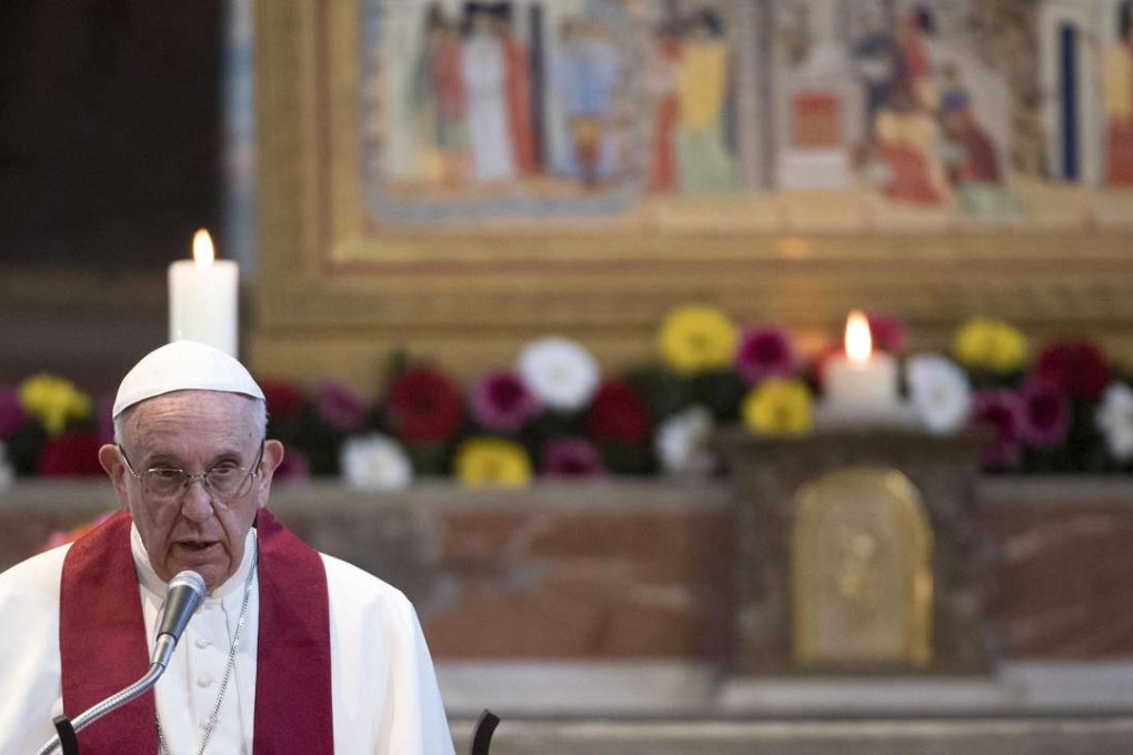 Pope Francis leads a mass at the Basilica of Saint Bartholomew on Tiber island in Rome, where he compared some refugee camps in Europe to concentration camps for their poor living conditions. Photo: Reuters