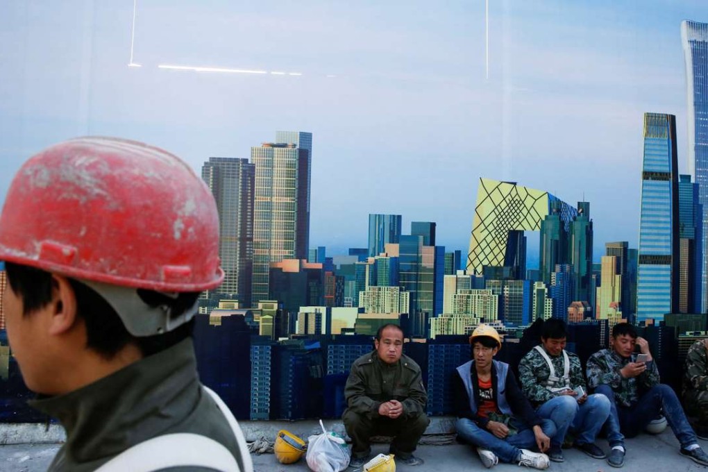 A file picture of workers outside a construction site in the centre of Beijing. Photo: Reuters