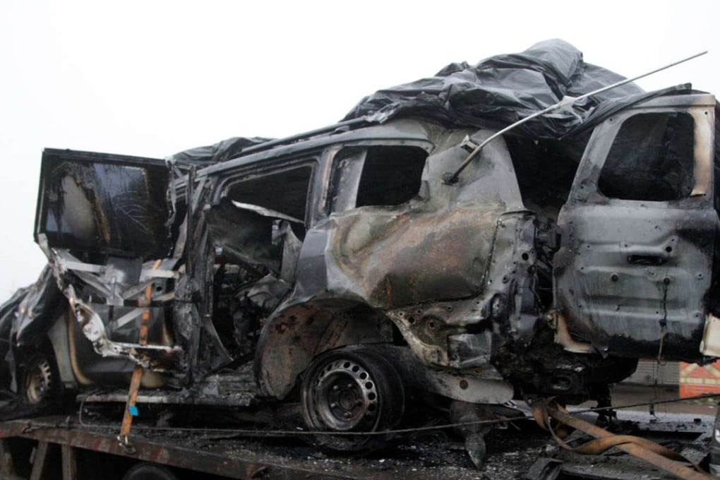 The damaged vehicle that drove over a mine while transporting members of the Organisation for Security and Cooperation in Europe (OSCE), who were killed and injured from the incident on Sunday, is moved from the scene in Luhansk region, Ukraine,. Photo: Reuters