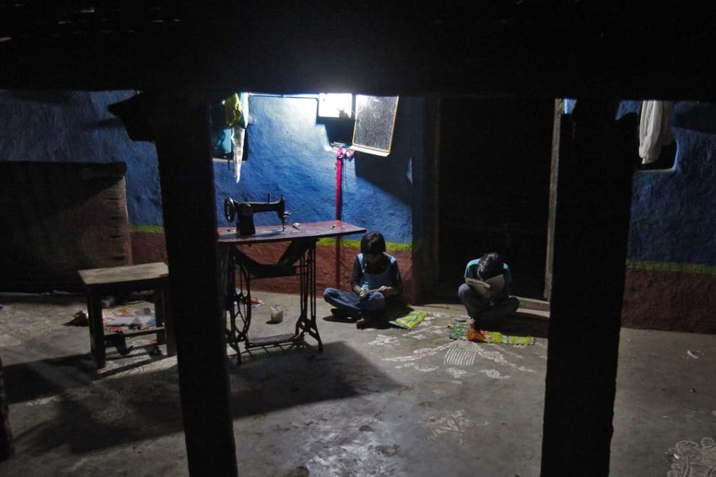 Girls study inside their house in the central Indian state of Madhya Pradesh. A study has shown that 50 million girls and 73 million boys are the victims of abuse in India. Photo: Reuters