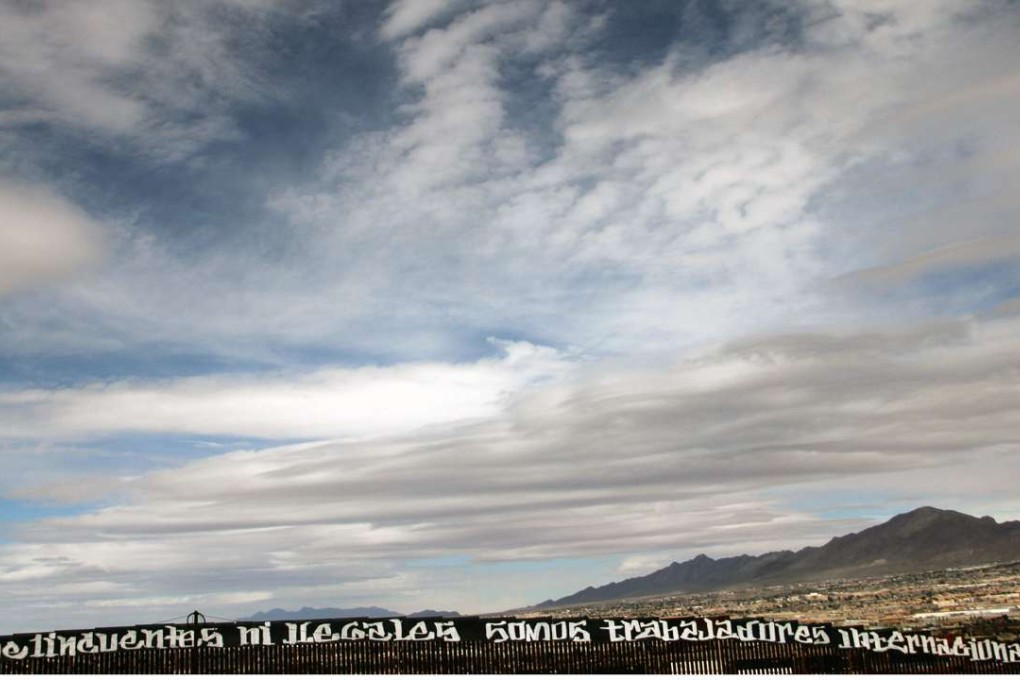 Grafitti targetting Donald Trump is seen on the Mexican side of the border fence between Mexico and the United States near Ciudad Juarez in Chihuahua State. Photo: AFP