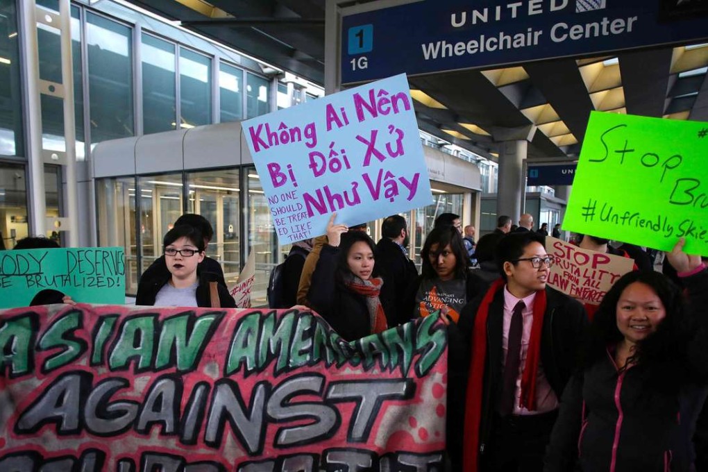 Demonstrators protest United Airlines at O'Hare International Airport on April 11, 2017 in Chicago, Illinois. The protest was in response to airport police officers physically removing passenger Dr. David Dao from his seat and dragging him off the air plane, after he was requested to give up his seat for United Airline crew members on a flight from Chicago to Louisville in Kentucky. Photo: AFP