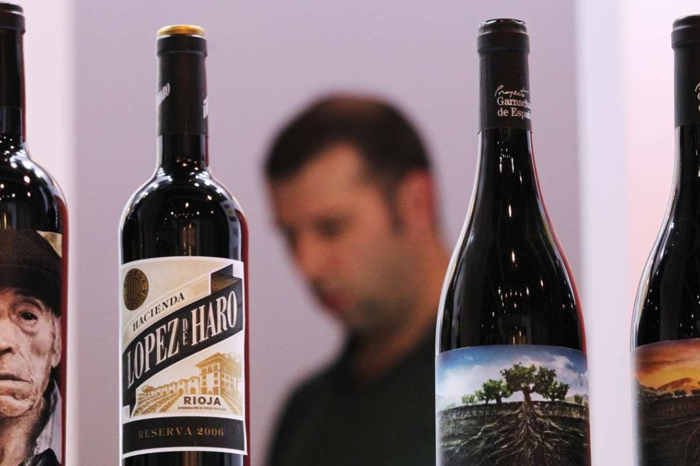 Staff from exhibitor Vintae setting up their booth to prepare for the sixth HKTDC Hong Kong International Wine & Spirits Fair in 2013, which featured wine and spirits from 40 countries and regions, including first-time exhibitors from Jordan, Lithuania, Montenegro and Morocco. Photo: Nora Tam