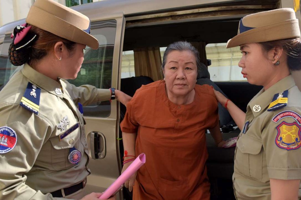 Lim Mony, a Cambodian senior officer from The Cambodian Human Rights and Development Association, leaves court in Phnom Penh. Photo: AFP