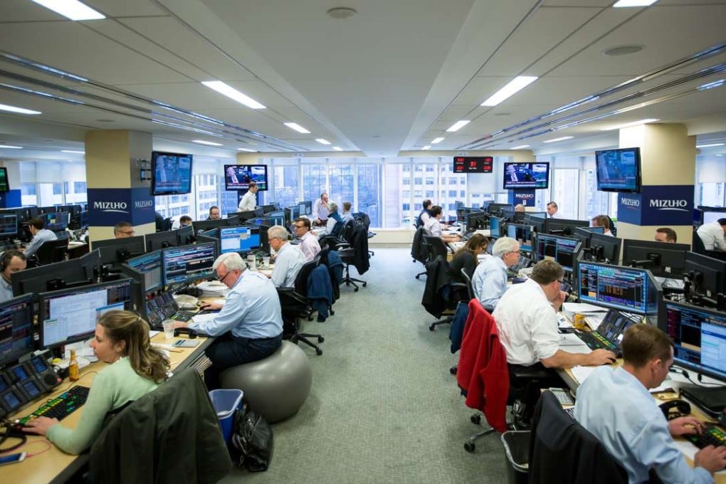 Glass-Steagall regulation, repealed in 1999, would not have prevented or ameliorated the global systemic collapse in 2008. Traders work on the Mizuho Americas trading floor in New York. Photo: Bloomberg
