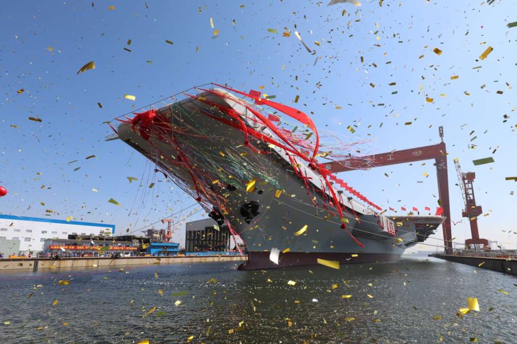 China’s new aircraft carrier is transferred from dry dock into the water at a launch ceremony in Dalian, Liaoning province, on Wednesday morning. Photo: Xinhua