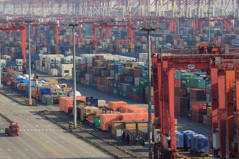 Containers are seen at the Yangshan Deep Water Port in the Shanghai Free Trade Zone. Over the past decade, the city has been shifting focus from manufacturing to financial services Photo: Reuters