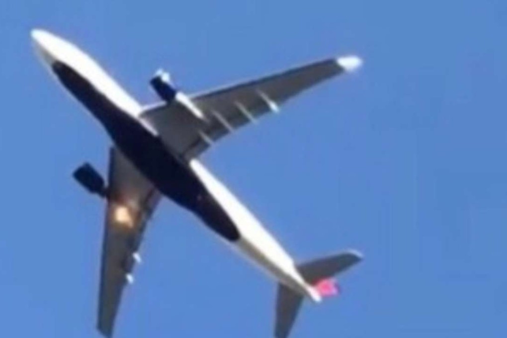 Flame shoots from one of the engines on Flight DL188. Photo: Weibo