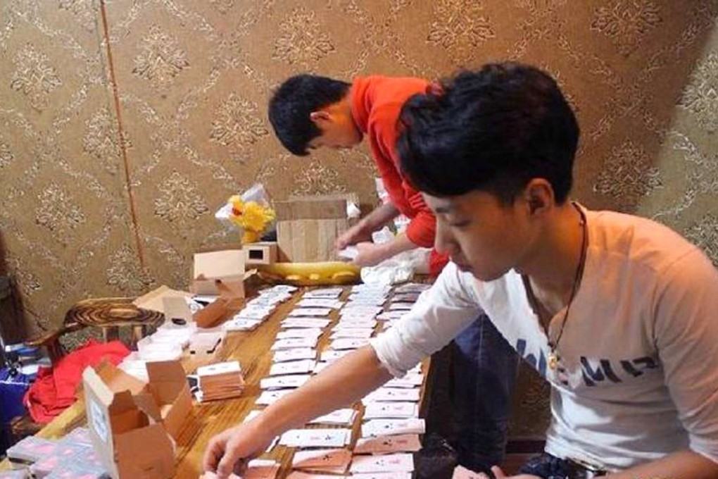 Game inventor Wang Kai lays his card on the table. Photo: handout