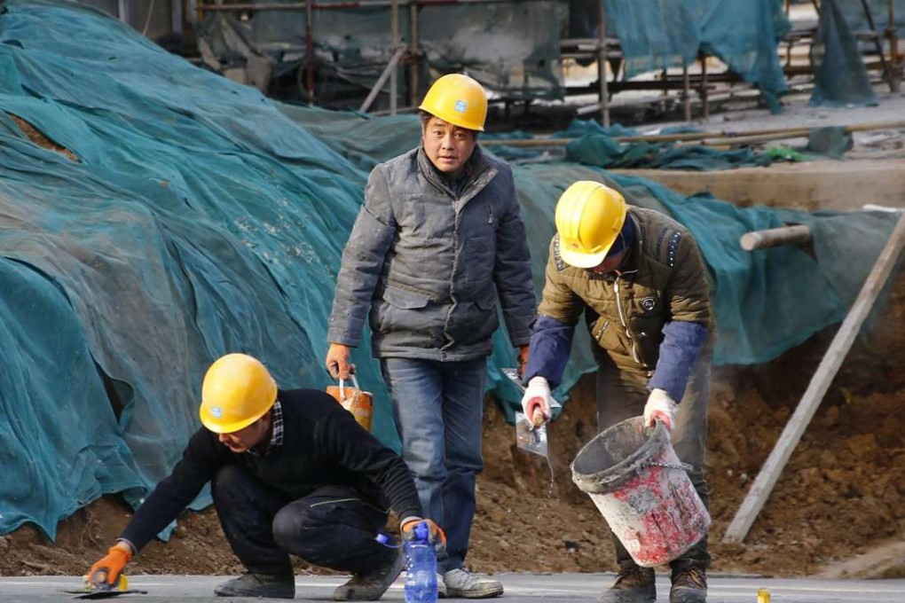 Migrant workers at a construction site in Beijing. Photo: EPA