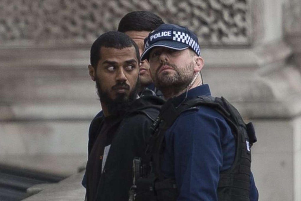 Police detain a man who was armed with knives near Westminster in Central London, on suspicion of plotting a possible terrorist attack. Photo: EPA