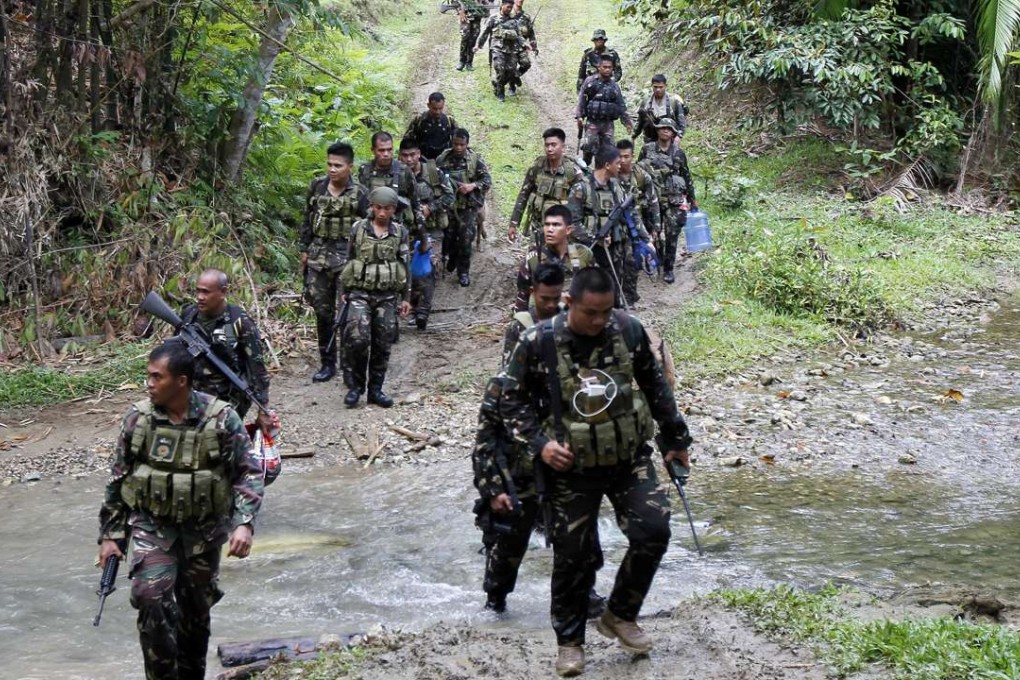 Filipino soldiers patrol in the town of Ibanga, Bohol island, Philippines. Photo: EPA