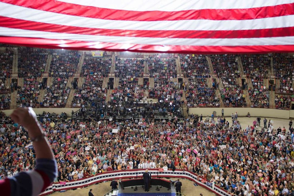 US President Donald Trump marks his 100th day in office at a rally. Photo: AFP