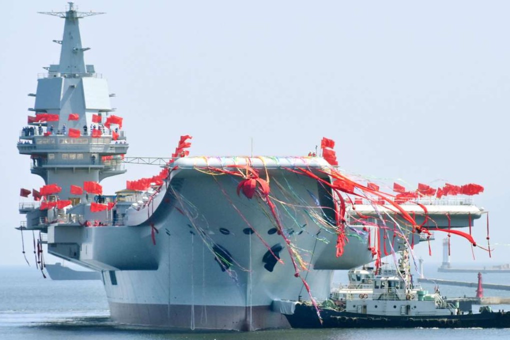 China's first domestically built aircraft carrier, the 50,000-tonne Shandong, is launched at a shipyard in the northeastern port city of Dalian. Photo: Kyodo