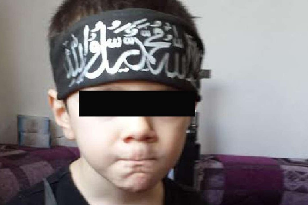 Sharrouf’s eight-year-old son holding a knife. Photo: The Daily Telegraph